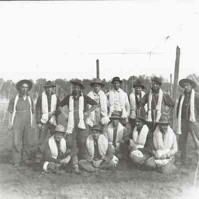 Photograph of a crew of stringers at a hopyard, unknown date
