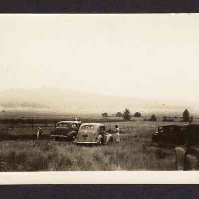 Photograph of People Near Cars Watching Air Show, 1930s-1940s