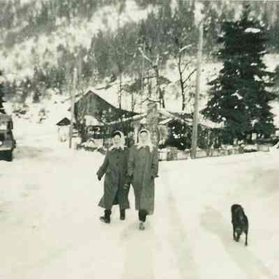 Photograph of Two Women walking in the Snow in Westfir, Oregon, Undated