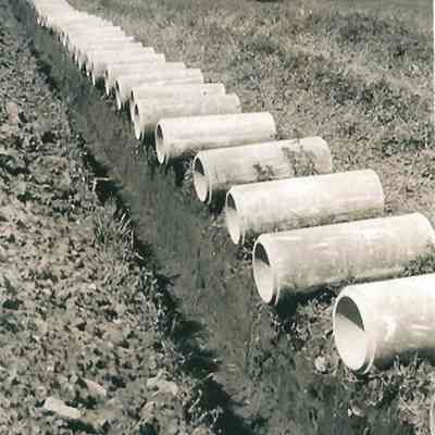 Photograph of Hand Dug Trench and Pipes, Undated