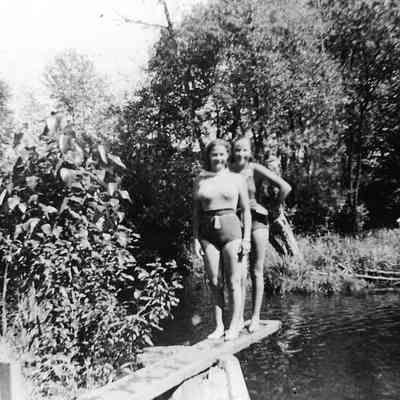 Photograph of two Girls standing on diving board, date unknown