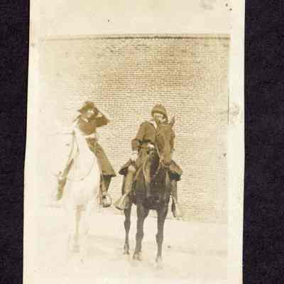 Photograph of two unknown women on horses
