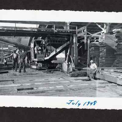 Photograph of 5 unknown men working on the construction of a 24" drain at Booth-Kelly Lumber Mill, Springfield, Oregon, 1948