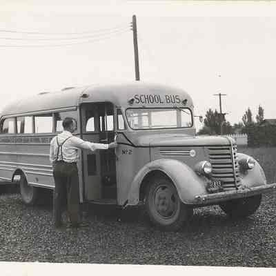 Photograph of Union High School bus and the principal Owen Sabin, circa 1942