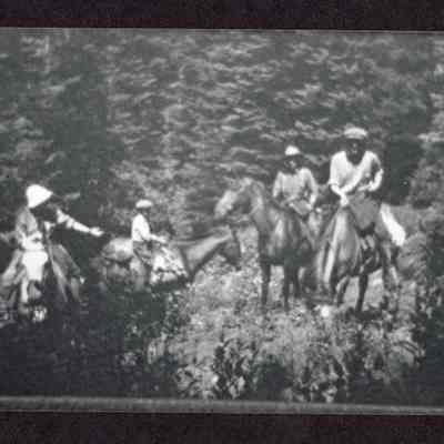 Photograph of George Croner bringing three other people up to the lookout