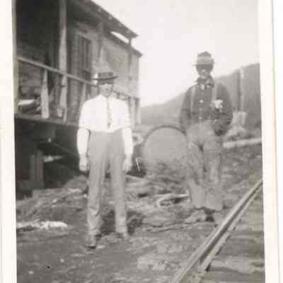 Photograph of two unidentified men by railroad, Wendling, Oregon