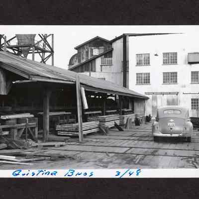 Photograph of mill materials and building