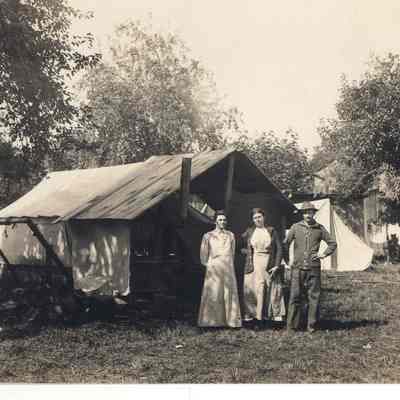 Photograph of Rudolph Wenger, Mrs. Wenger and Mrs. Franklin in a field, circa 1914