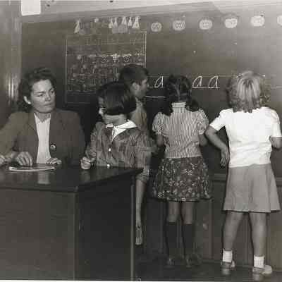 Classroom with teacher and five students.