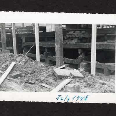 Photograph of the draining and filling of the old log pond at Booth-Kelly Lumber Mill