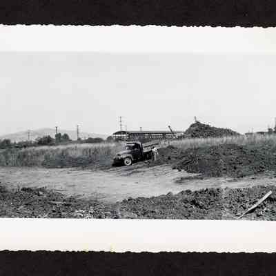 Photograph of the old log pond before being drained and filled at Booth-Kelly Lumber Mill