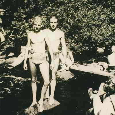 Photograph of Bill Mills and Doug Skordahl with others at a swimming hole