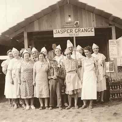 Photograph of the Jasper Grange booth and people at Lane County Fair, Oregon, 1939