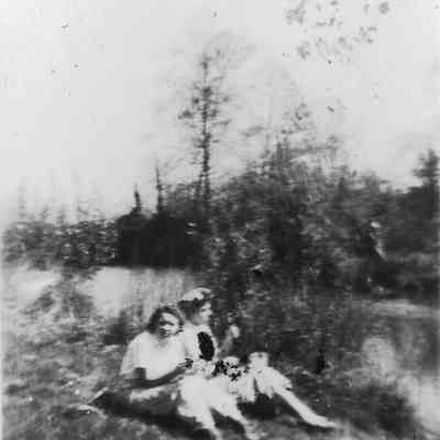 photograph of Millrace with two women picnicking, date unknown