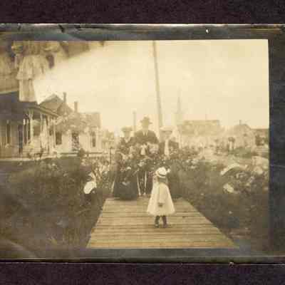 Photograph of girl and family on boardwalk, circa 1890s