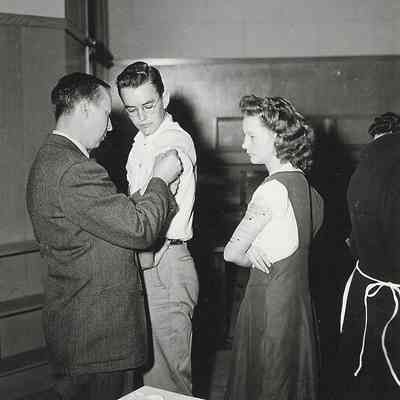 Photograph of two unidentified students receiving shots, Springfield, Oregon, unknown date