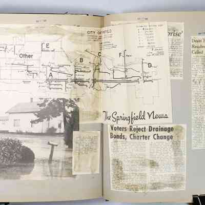 Pages 112-113 unfolded newspaper clipping
