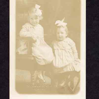 Photograph on postcard of two girls: Grace and Helen