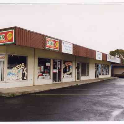 Photograph of shops on Main St & 14th St, Springfield, 1998
