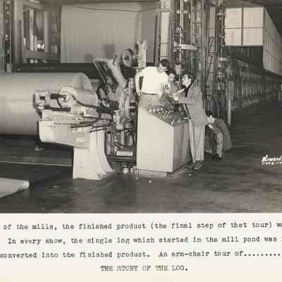 Photograph of four men inside an unknown mill looking at the pulp paper, Springfield, Oregon, circa 1945-1951
