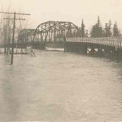 Photograph of the flooding river, taken at the McKenzie River, Oregon, 1943