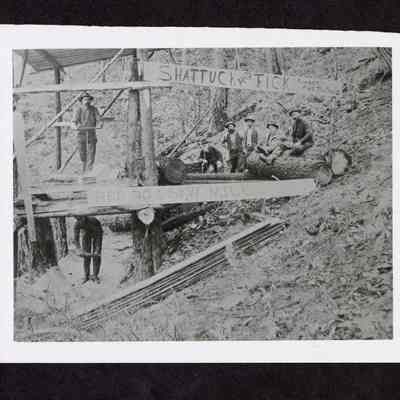 Photograph of seven men at Red Dog Saw Mill
