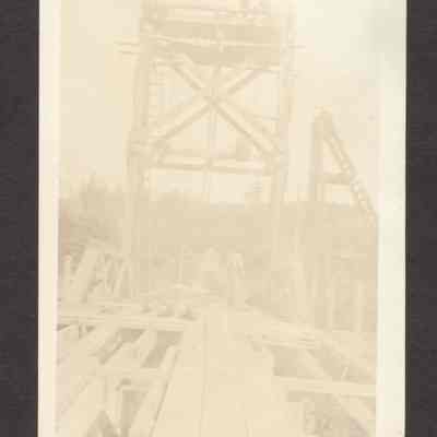Photograph of workers on a bridge, undated