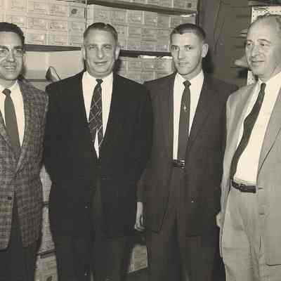Four men in shoe store