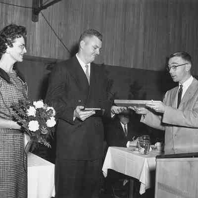 Photograph of Don Lutes giving Jaycee State Award to Roger Wiley, 1959.