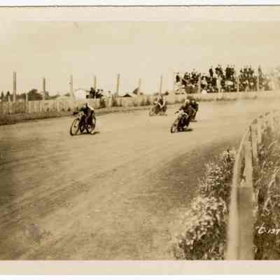 Photograph of motorcyclists on a speedway, undated