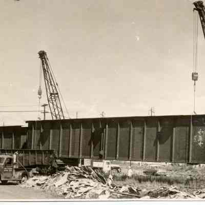 Photograph of crane unloading new girders for bridge over Willamette, date unknown.