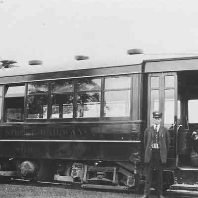 Photograph of a Streetcar and Conductor