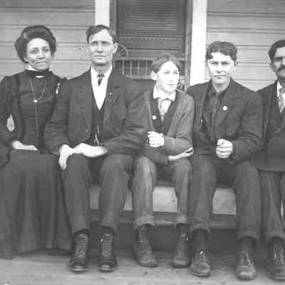 Photograph of Mountjoy family sitting on house step