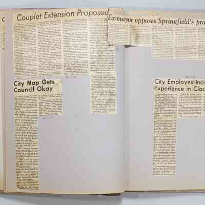 Pages 6-7 newspaper clipping unfolded