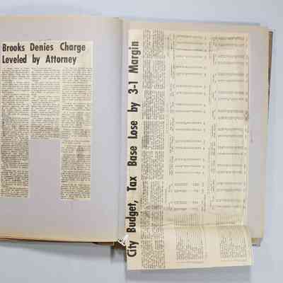 Pages 12-13 newspaper clipping unfolded