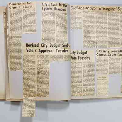 Pages 32-33 unfolded newspaper clipping
