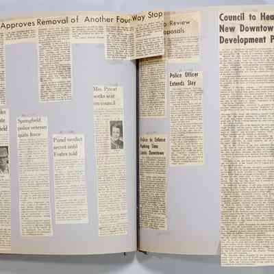 Pages 54-55 newspaper clippings unfolded
