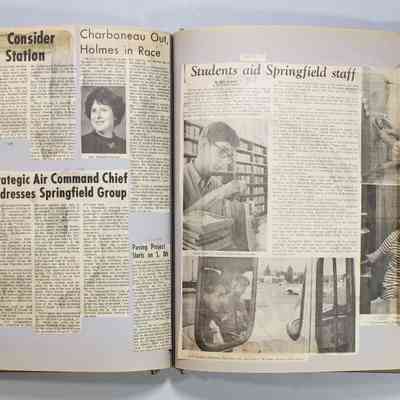 Pages 60-61 newspaper clipping unfolded