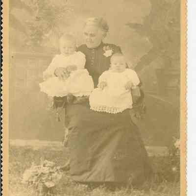 Photograph of portrait of Rhoda Higgins with babies, c. 1890-1910