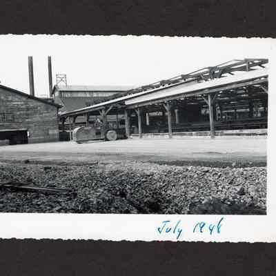 Photograph of the filling of the old log pond at Booth-Kelly Lumber Mill