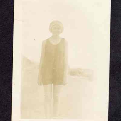 Photograph of a woman at the beach, undated