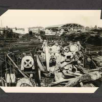 Photograph of burned machinery and lumber at Clear Fir Mill, Springfield Oregon, circa 1949