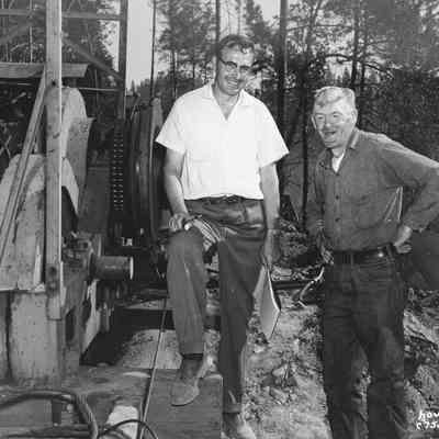 Photograph of Two Men and a Donkey Engine