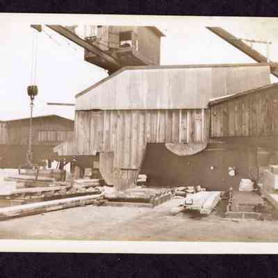 Photograph on postcard of timber, flitch and cant dump at Jones Lumber Company, Portland, Oregon, date unknown