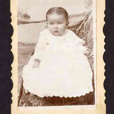 Photograph of unknown baby in a white dress
