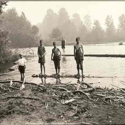 Photograph of 5 boys in a Log Pond, Undated