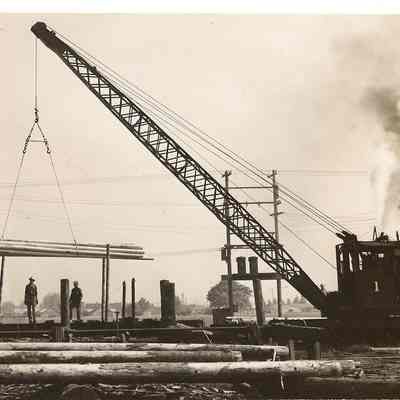 Photograph of Steam Crane Moving Logs, Unknown date and location