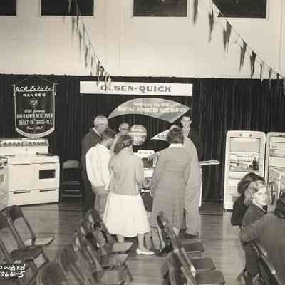 Photograph of people examining Maytage washer at Springfield Electric Appliance Show, Springfield, Oregon, 1954