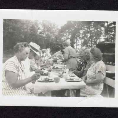 Photograph of a group having a picnic, circa 1950