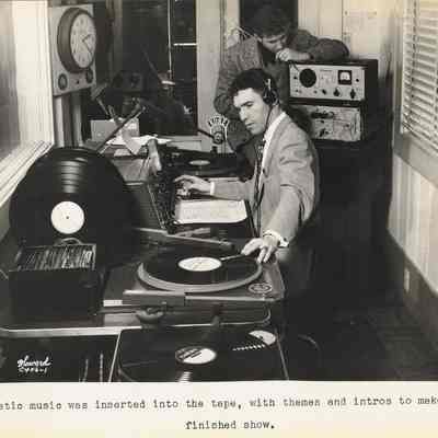 Photograph of two men at K.O.R.E. inserting music into the story, Eugene, Oregon, circa 1950s